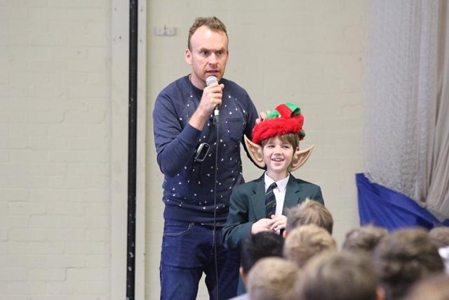 cheadle hulme school junior dresses as an elf during a talk by Christmas book author Matt Haig