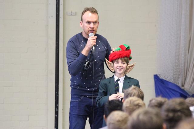 Matt and CHS's Chief Elf! cheadle hulme school junior dresses as an elf during a talk by Christmas book author Matt Haig