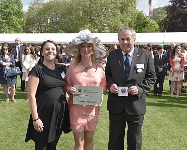 cheadle hulme schools duke of edinburgh award co-ordinator collects the school's licensed organisation plaque at buckingham palace in the diamond anniversary celebrations