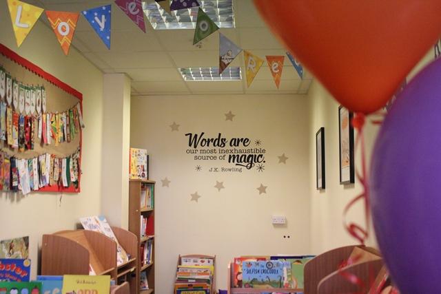 view of cheadle hulme school's colourful new infant library full of books and inspirational quotes  