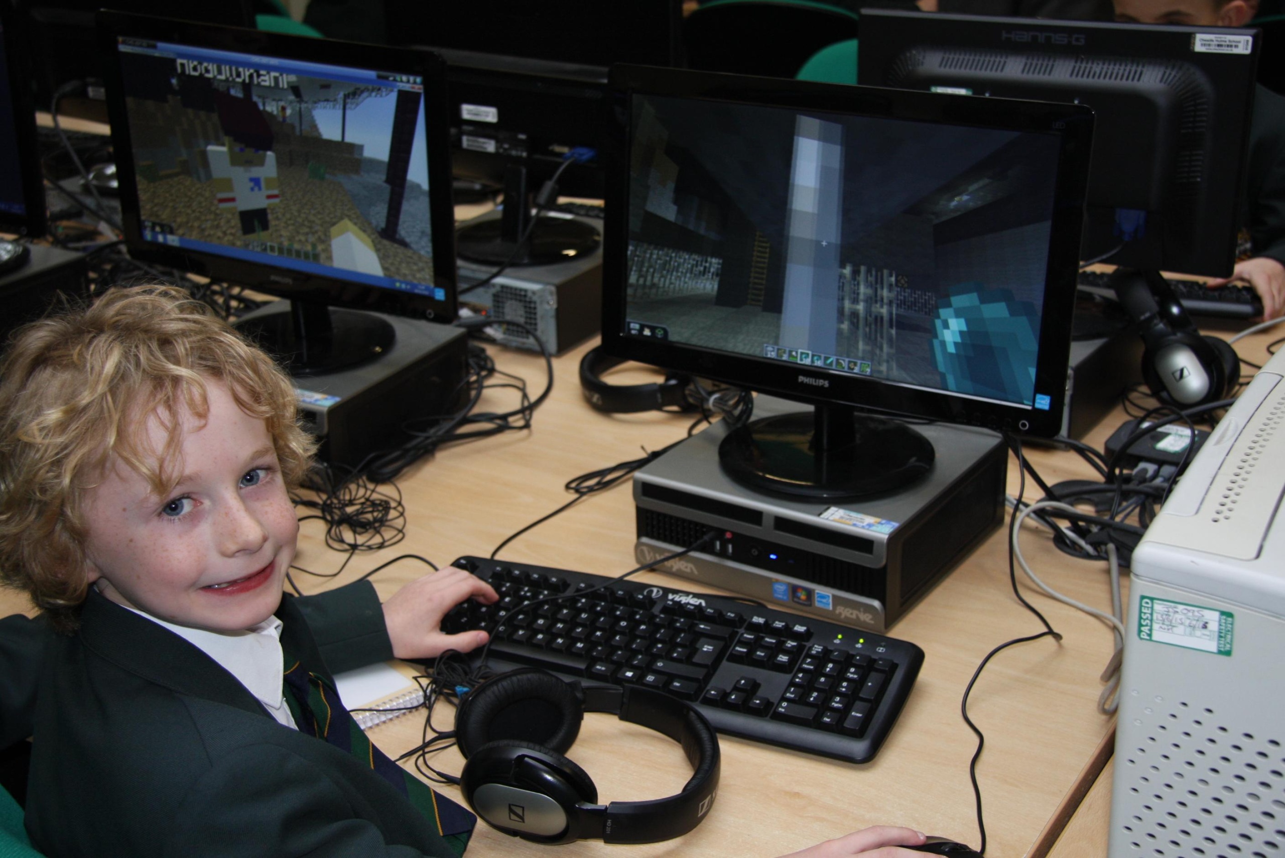 CHEADLE hulme school year 4 pupil kiaran sits at his computer where he types up his news report about the School's weekly Minecraft club during Journalism Club