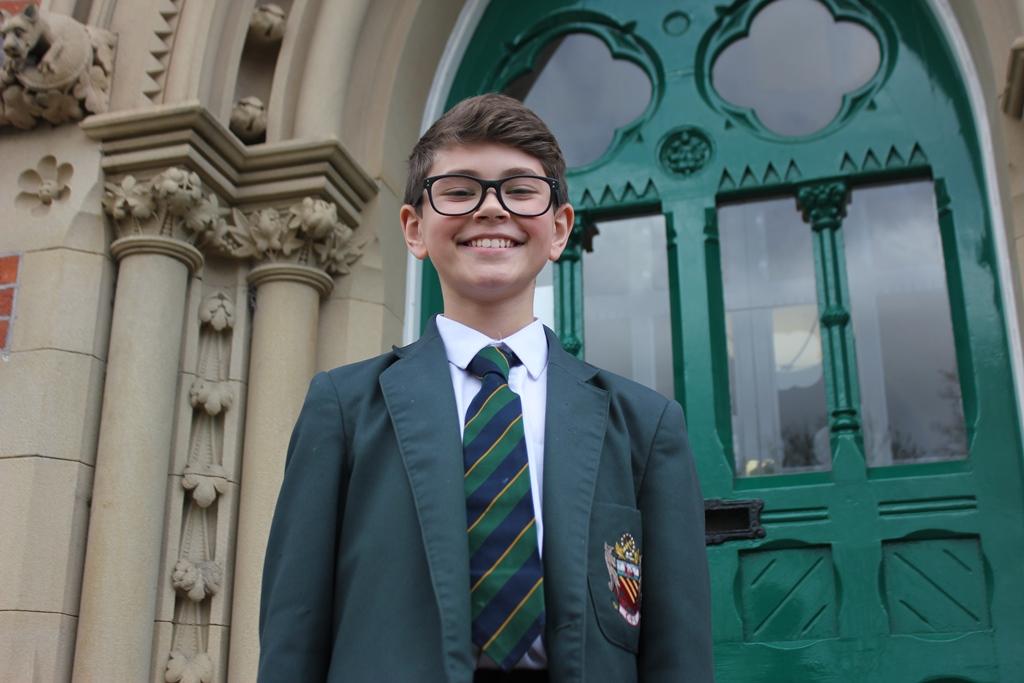 Joe on his last day at CHS cheadle hulme school junior pupil joe birtles-clarke smiles at the camera on the school steps after being selected to join London's Royal Ballet School