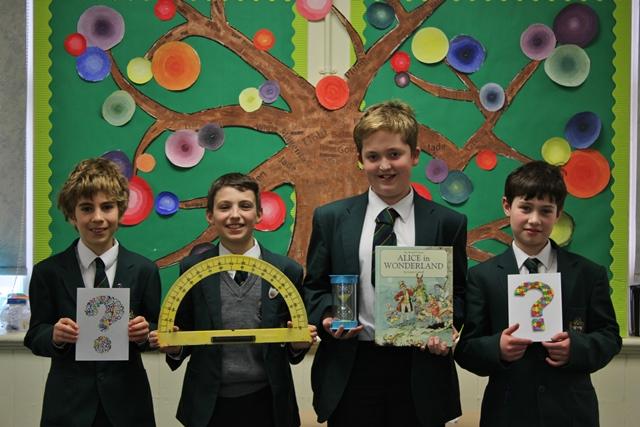 Members of cheadle hulme school's junior school quiz club show items they were asked questions about when the picked up the runners up prize in the AIJS Quiz 