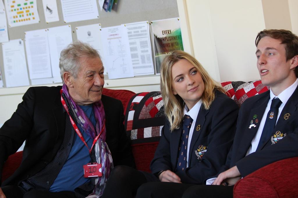 Stonewall ambassador Sir Ian McKellen talks with Head Boy and Head Girl in Cheadle Hulme School Sixth Form