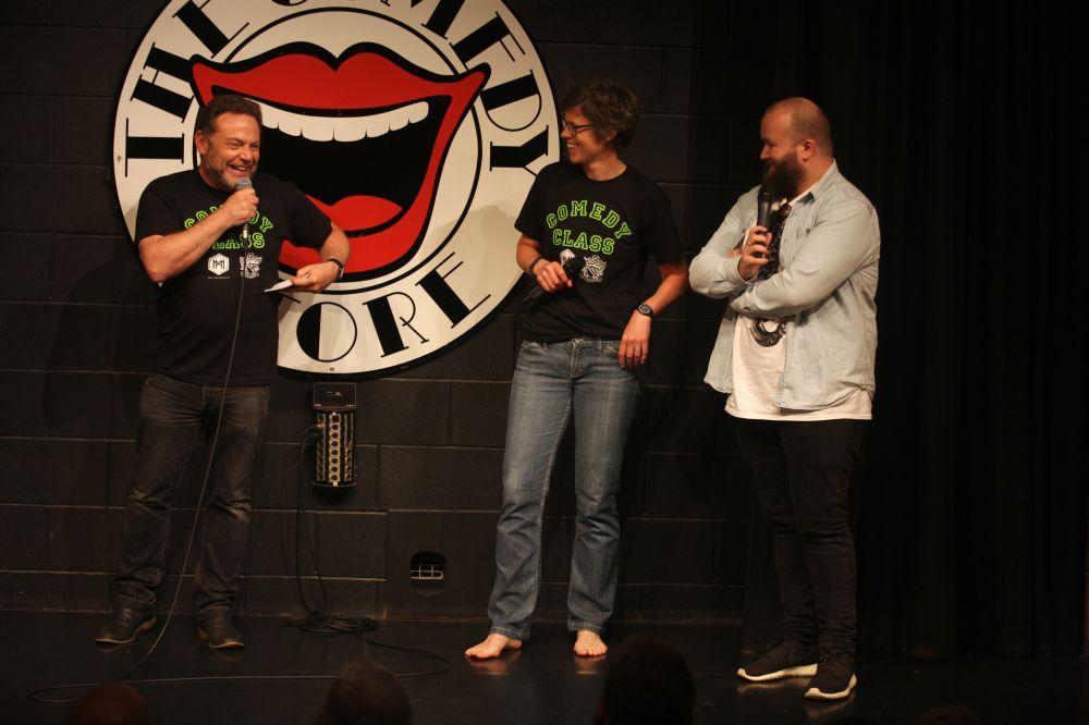 On stage at CHS Comedy Class actor and tv personality john thomson from cold feet and the fast show jokes with cheadle hulme school head lucy pearson and her mentor Freddie quinn at the comedy store manchester during the comedy class fundraiser for teenage cancer trust and made from