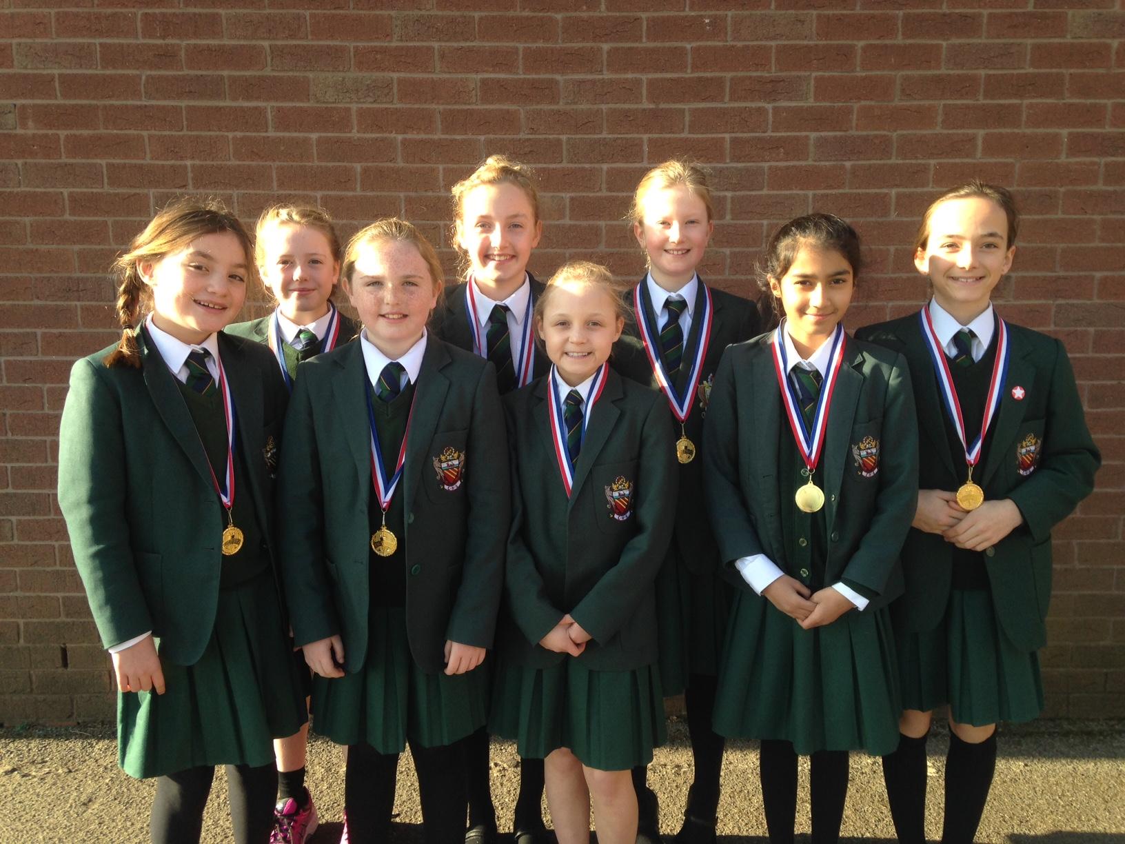 Year 5 Junior pupils at cheadle hulme school show off their gold medals after winning at the U10s North West Area Netball Tournament